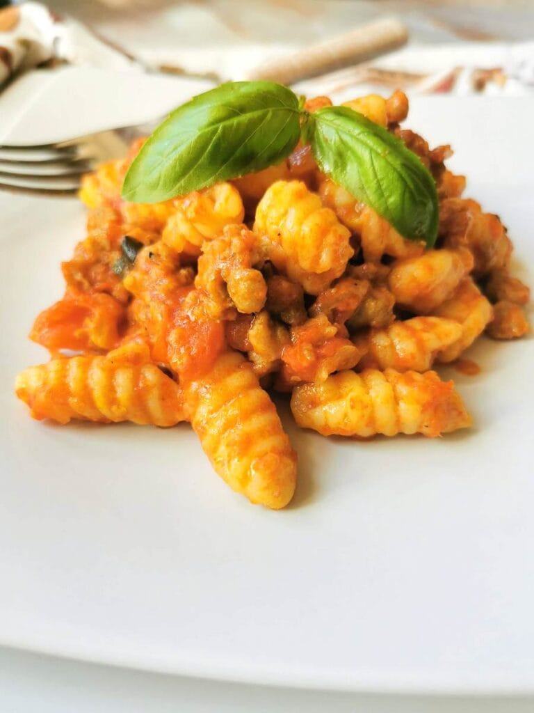 Sardinian gnocchi-malloreddus with sausage, tomato and saffron alla campidanese