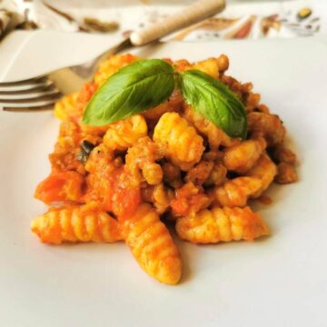 Sardinian gnocchi-malloreddus with sausage, tomato and saffron alla campidanese