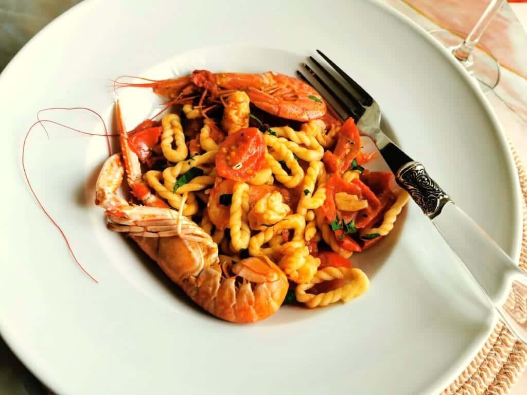 Sardinian lorighittas pasta with prawns and scampi.