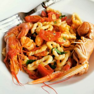 Sardinian lorighittas pasta with prawns and scampi.