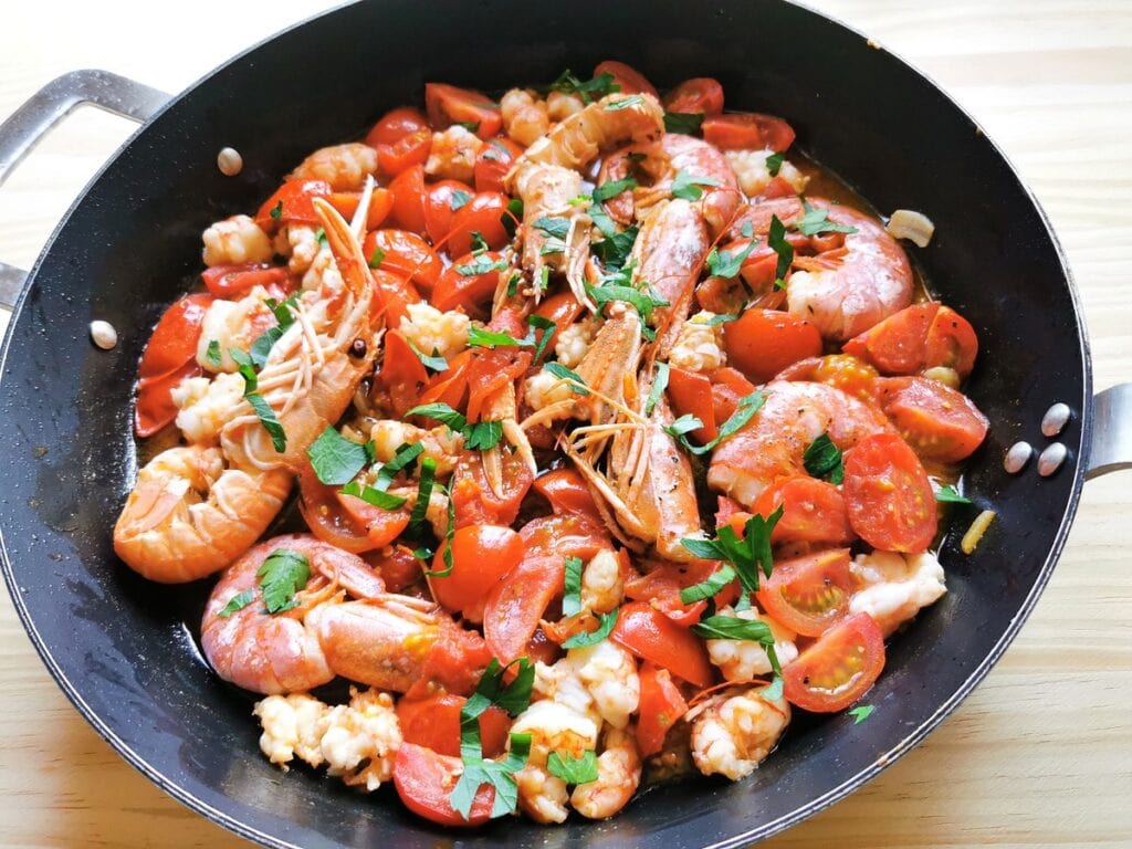 Sardinian lorighittas pasta with prawns and scampi. Seafood pasta recipe from Sardinia