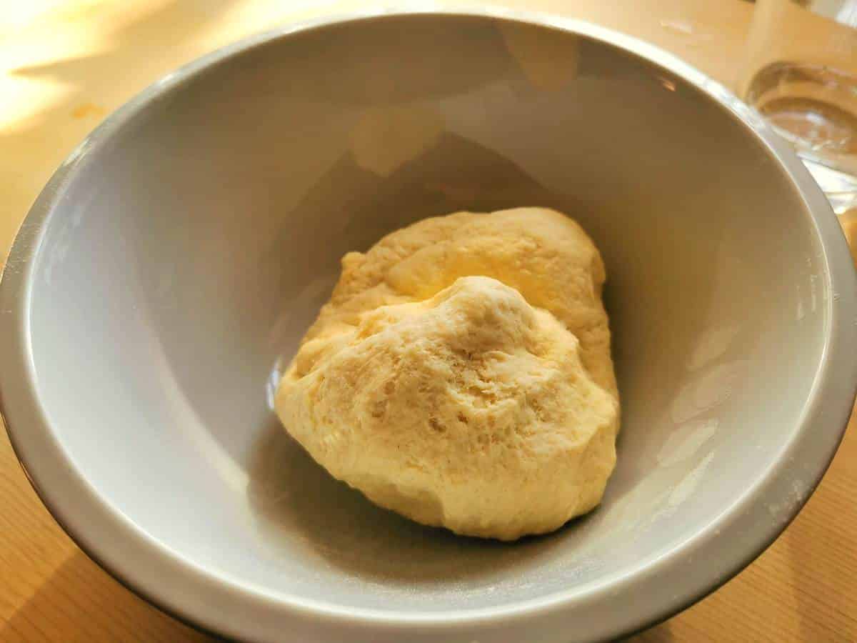 ready pasta dough in white bowl