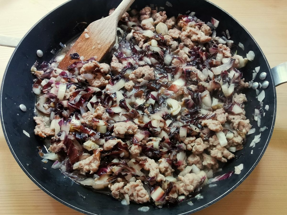 Ready cooked radicchio with shallots in skillet.