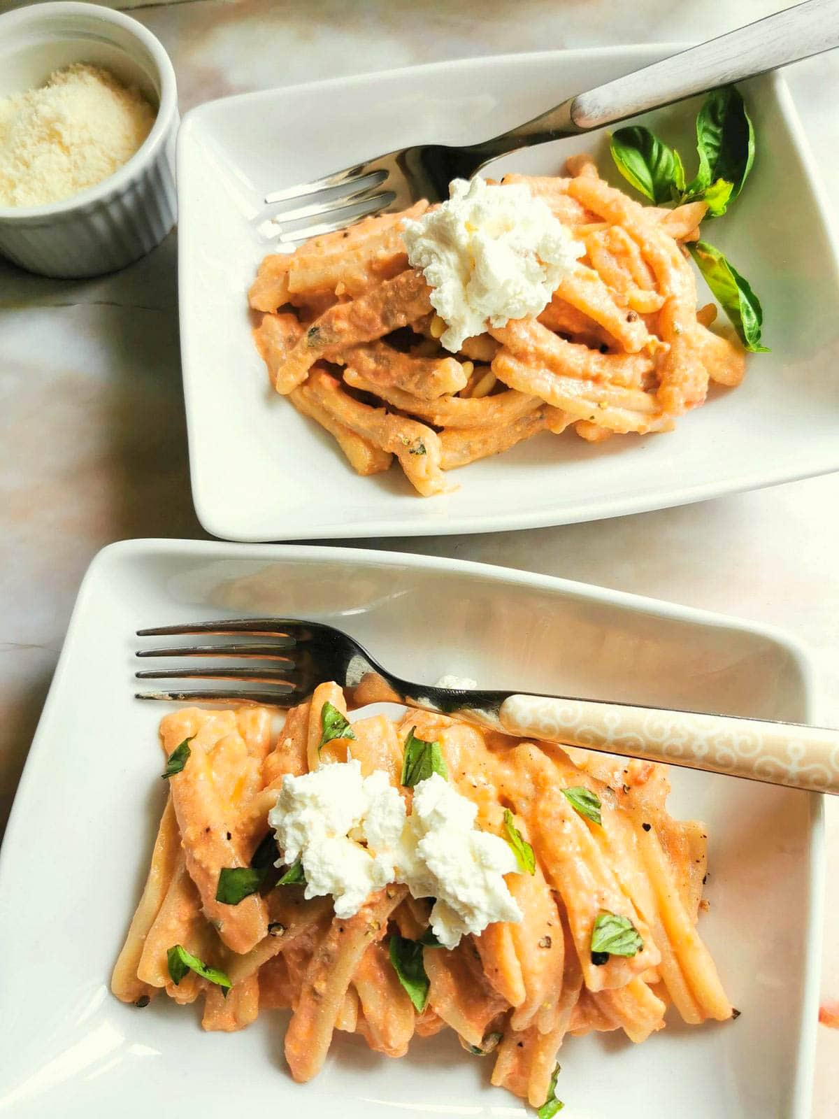 Two bowls of Sicilian pesto pasta