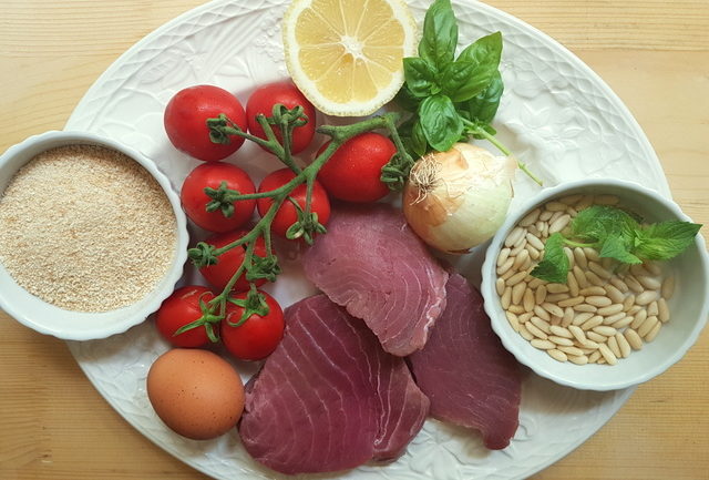 ingredients for Sicilian fresh tuna meatballs on white plate