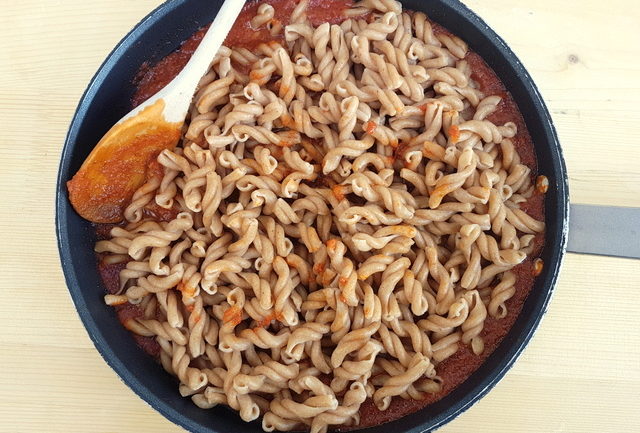 organic Sicilian ancient grains gemelli pasta and Hyblaean pesto in frying pan