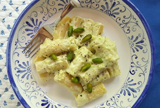Sicilian ricotta and pistachio pasta in blue and white bowl