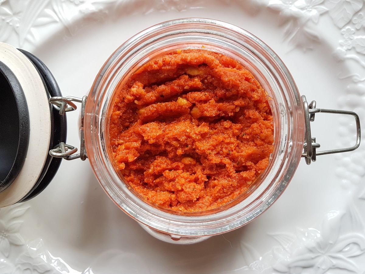 A mason jar of sun-dried tomato pesto.