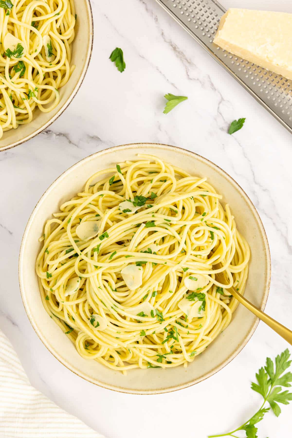 Two bowls of pasta aglio e olio 