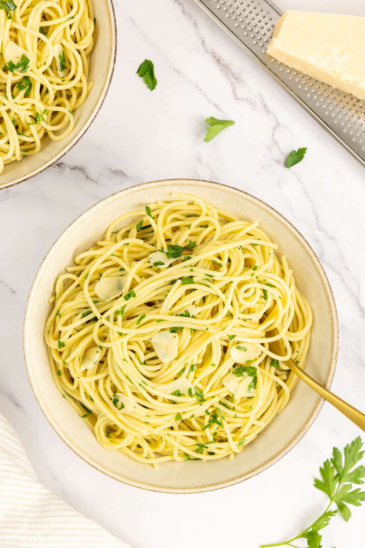 Two bowls of pasta aglio e olio