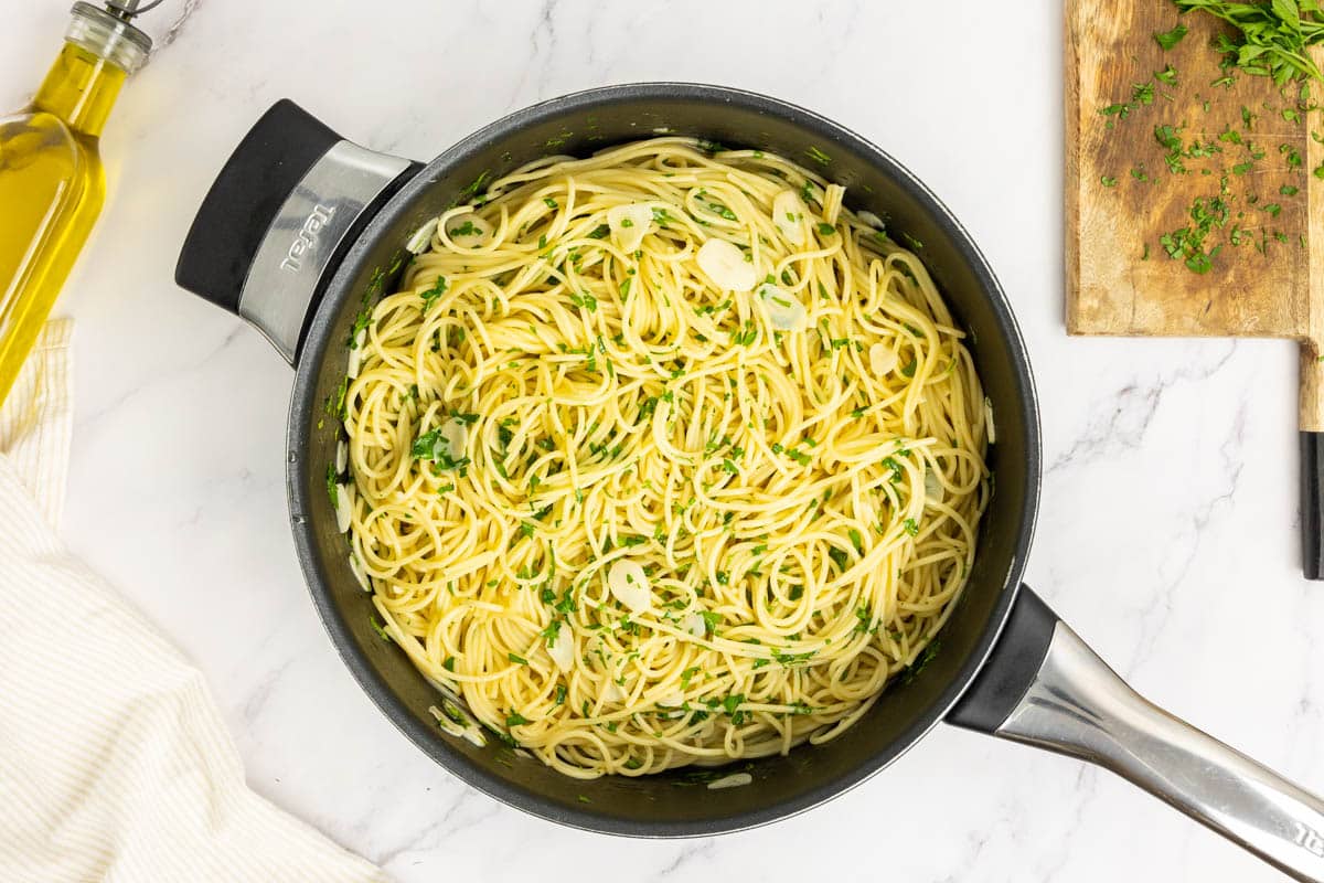 Spaghetti aglio e olio in a large saute pan