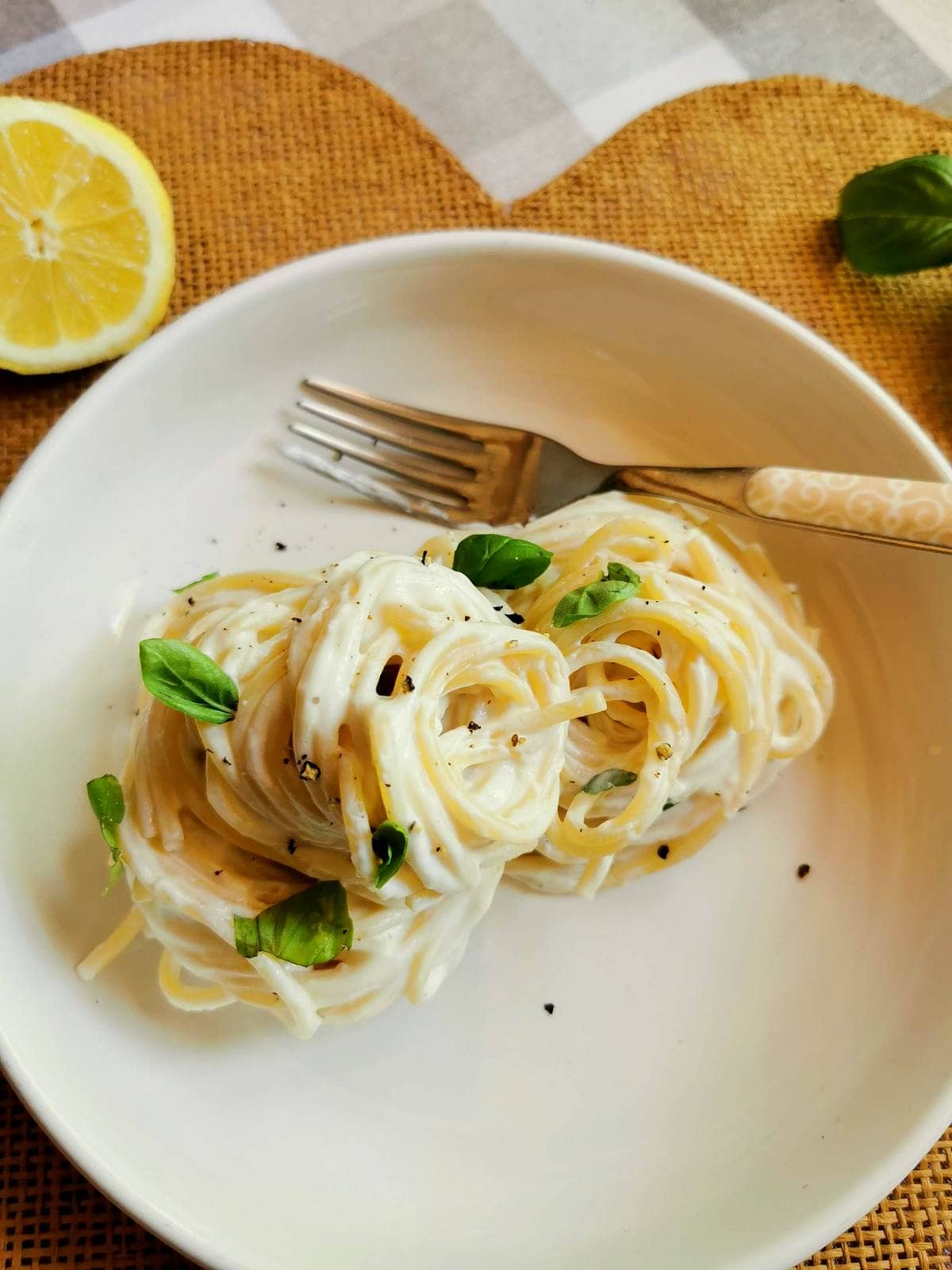Italian spaghetti al limone with ricotta, basil and lemon