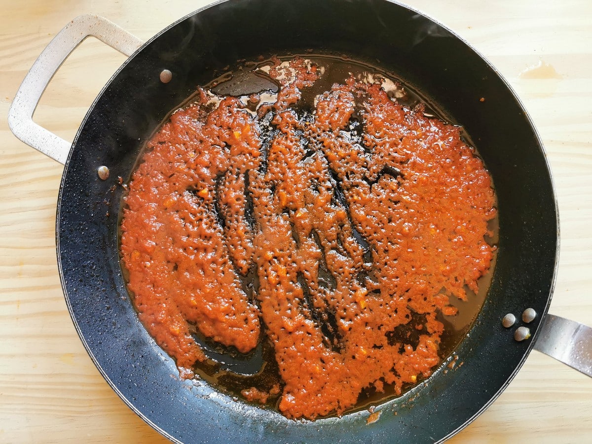 tomato passata cooking in skillet