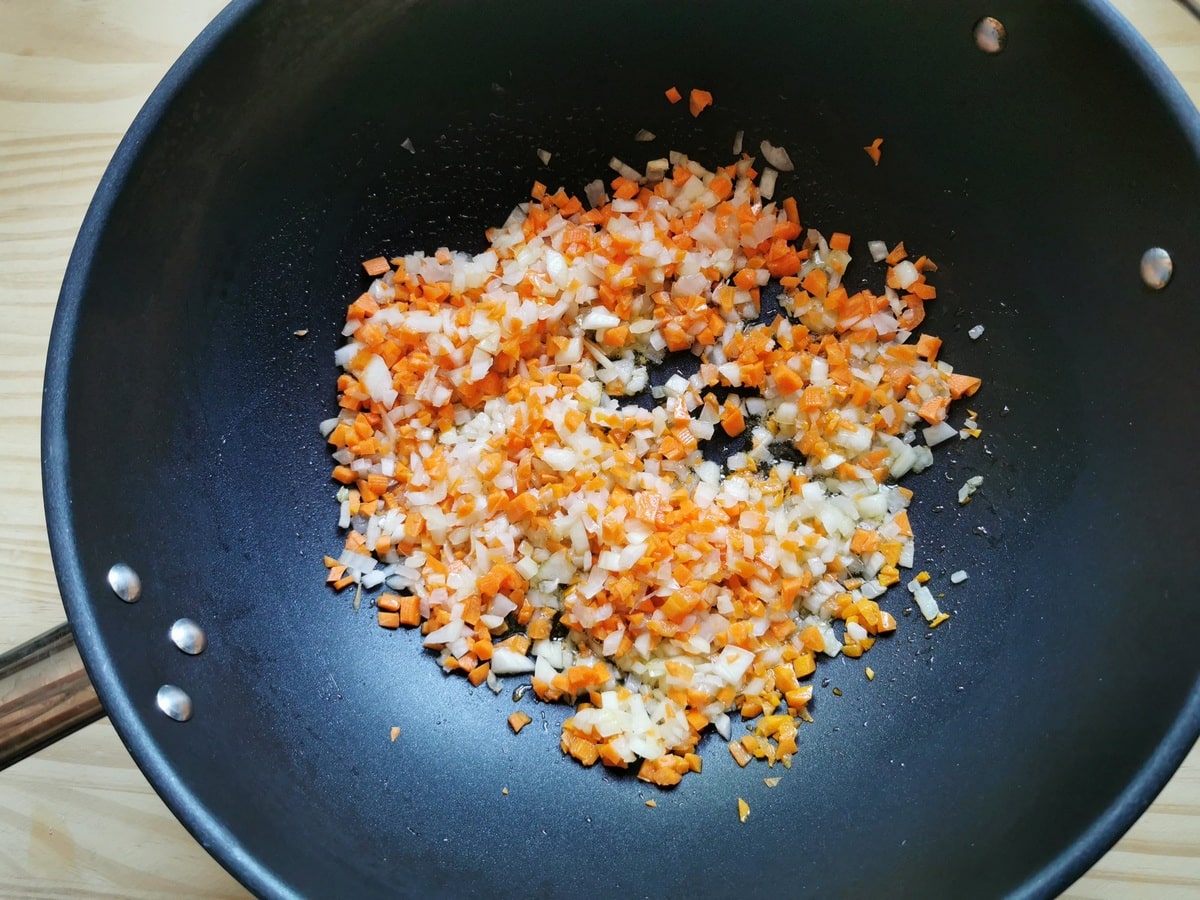 Finely chopped onion, carrot and celery in large deep frying pan.