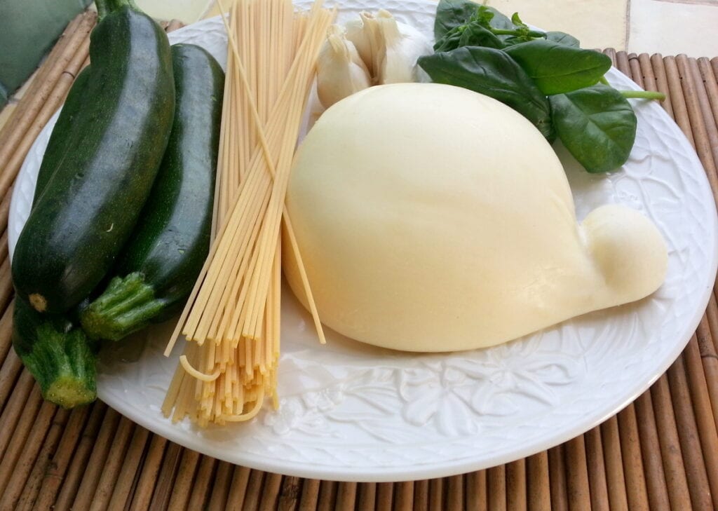 ingredients for spaghetti alla Nerano on white plate