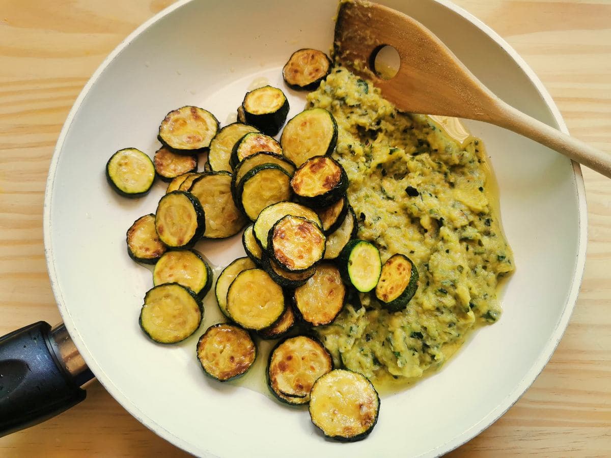 creamed zucchini, and zucchini slices in white frying pan.