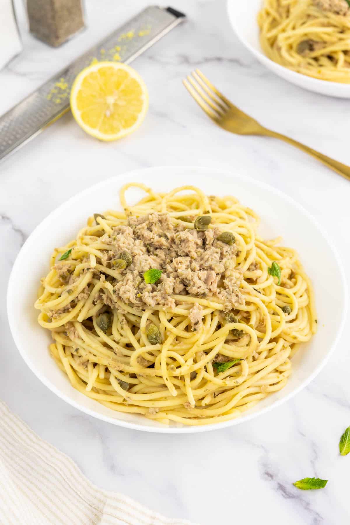 Two bowls of canned tuna with spaghetti