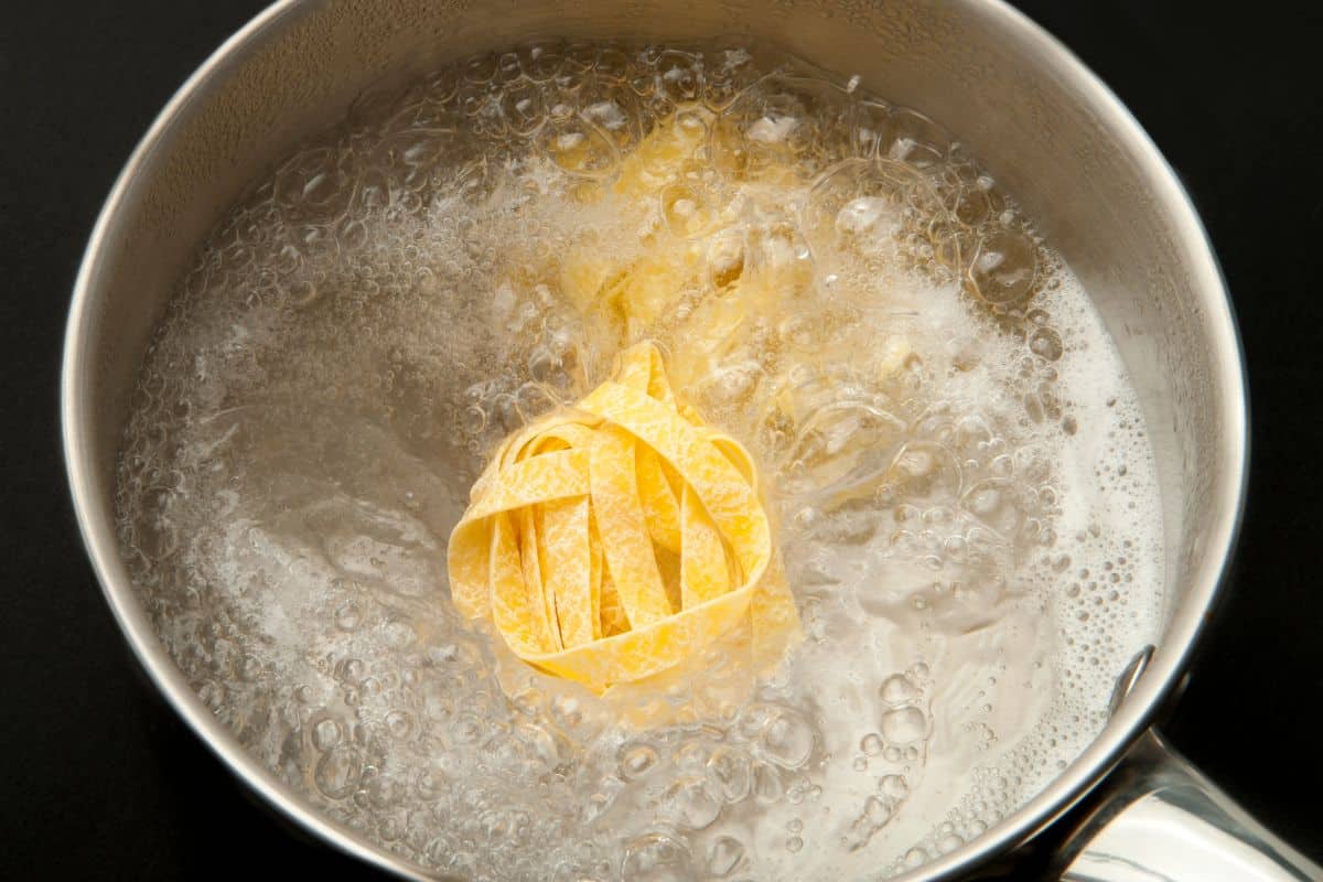 Tagliatelle cooking in boiling water.