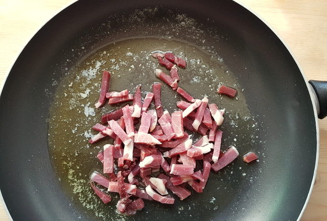 juliennes of prosciutto San Daniele in frying pan with butter