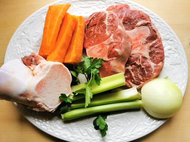 beef broth ingredients on white plate