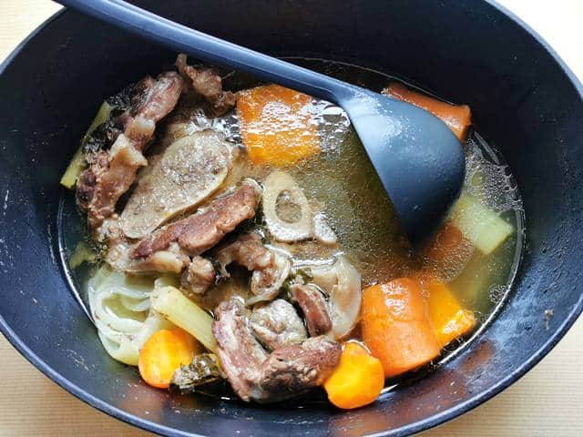 cooked beef broth in Dutch oven before filtering