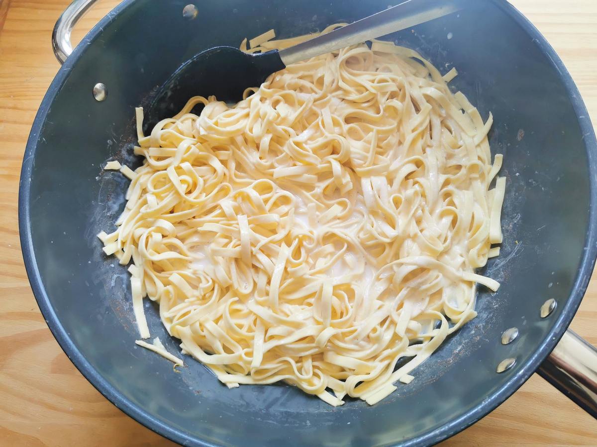 Tagliolini cooked in sweetend milk in deep skillet.