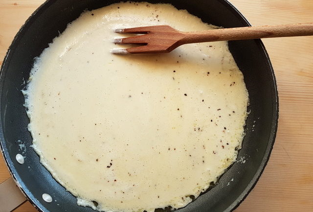 Taleggio cheese sauce cooking in frying pan