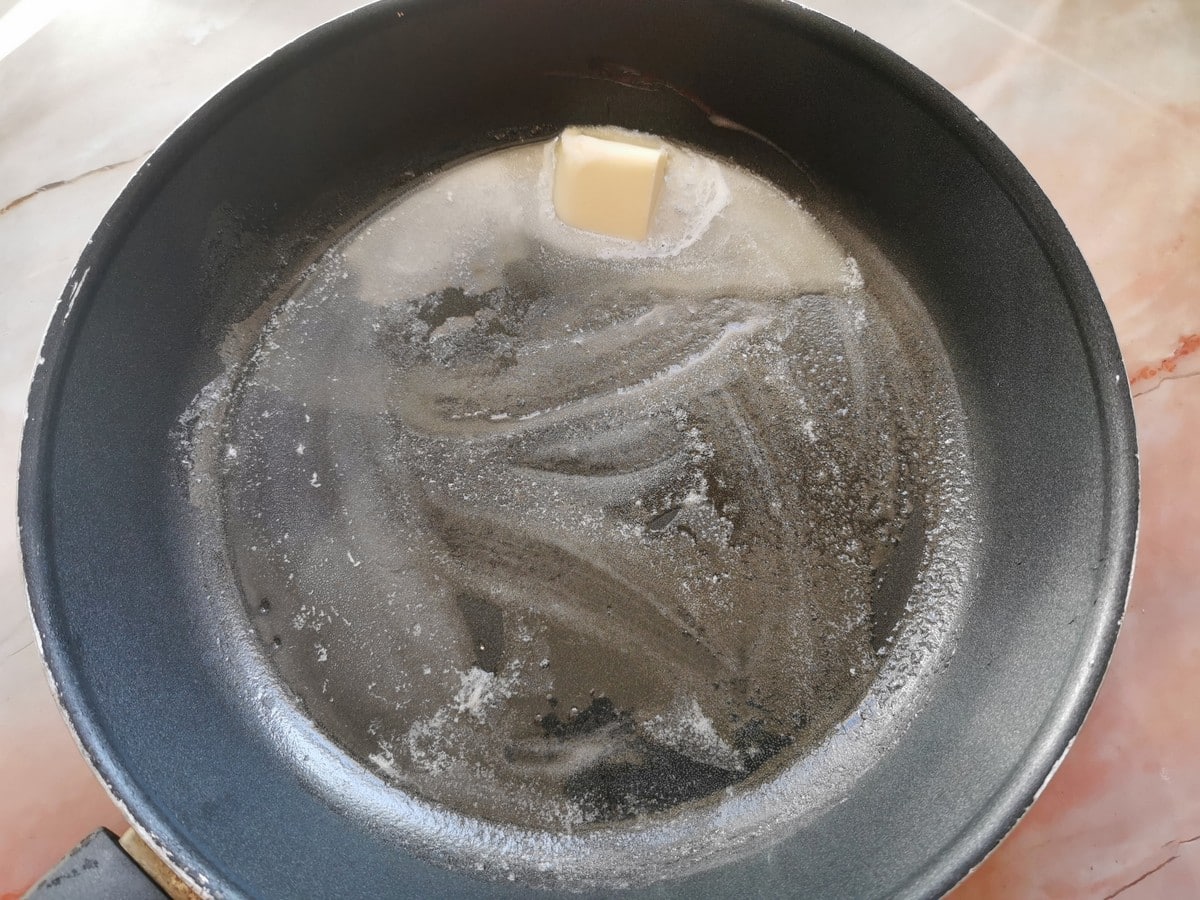 Butter melted in large skillet.