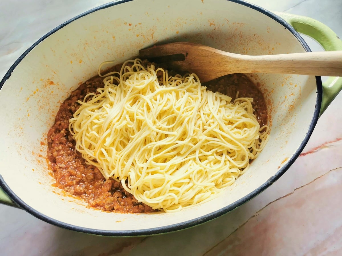 Cooked fresh tajarin (tagliolini) in Dutch oven with sausage ragu.