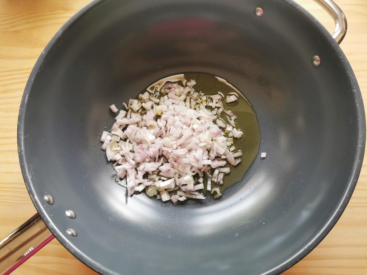 Peeled and chopped onion in skillet with olive oil.