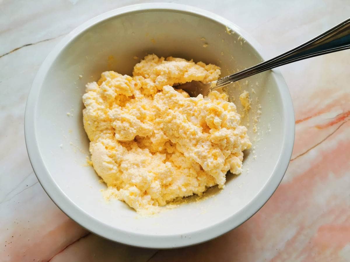 ready ricotta ravioli filling in white bowl