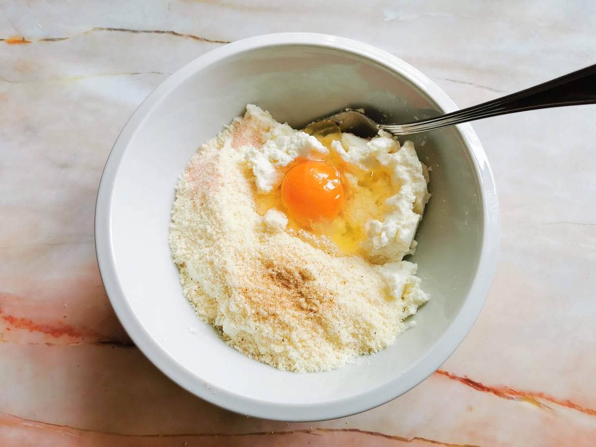 ingredients for ricotta ravioli in white bowl