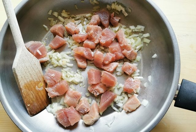 tuna chunks and onions in frying pan