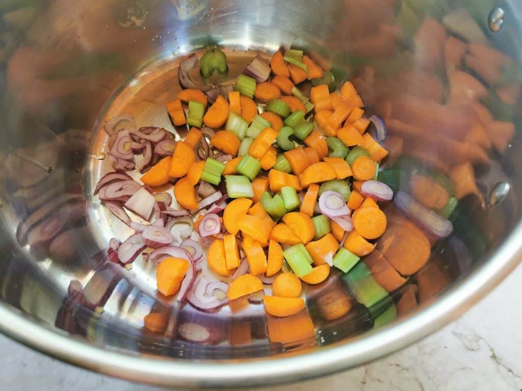 a 'soffritto' of carrots, onions and celery in deep pan.