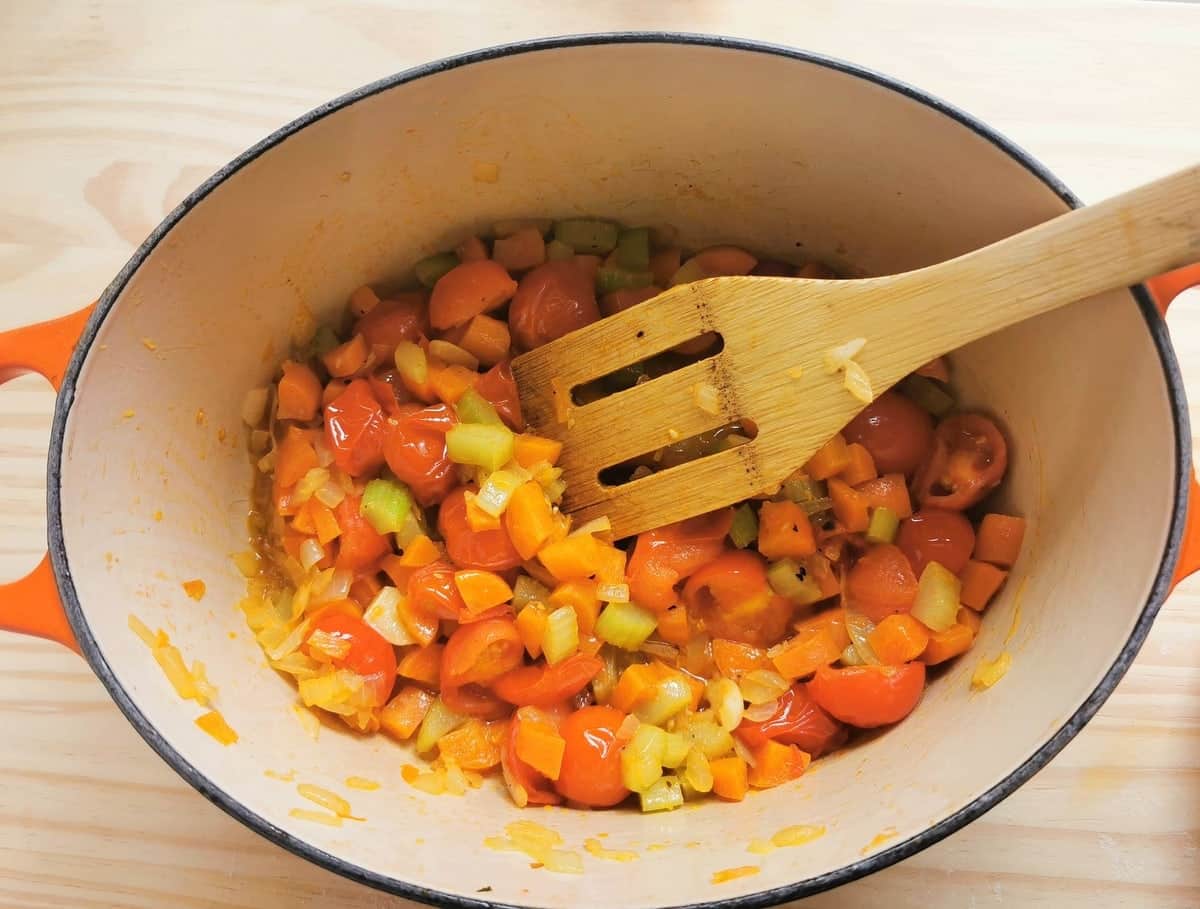 Cooked tomatoes, carrots, celery and onion in Dutch oven