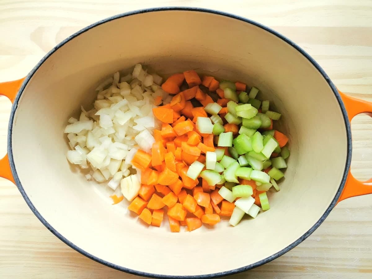 chopped onions, carrots and celery in Dutch oven