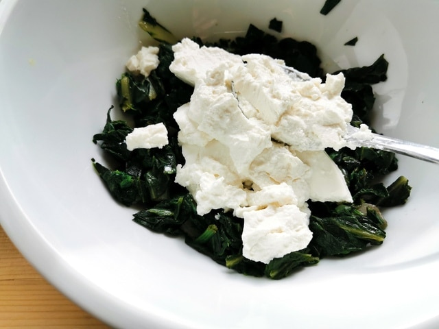 cooked and chopped Swiss chard and fresh ricotta in bowl