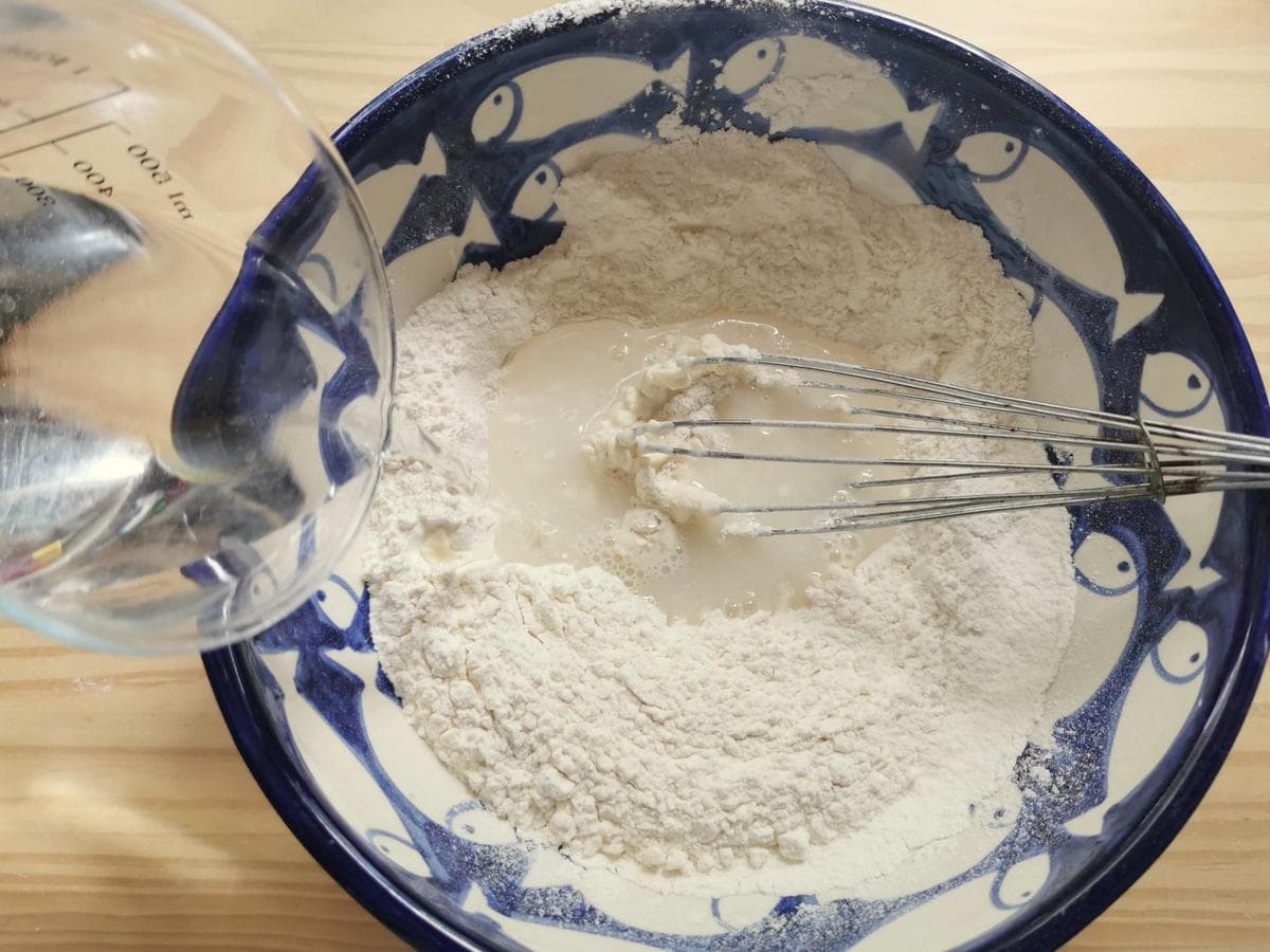 Step 1. Flour in large bowl with water being added.