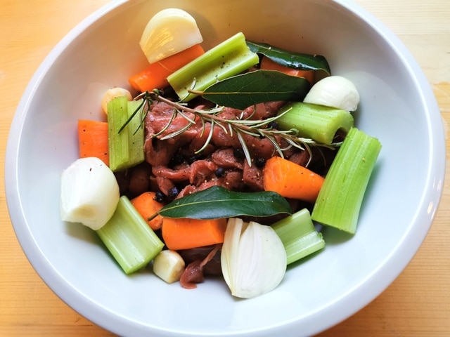 ingredients for wild boar ragu marinating in red wine