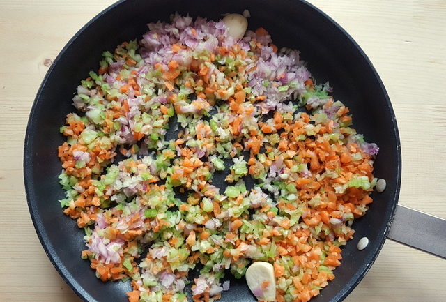 chopped vegetables and garlic in frying pan