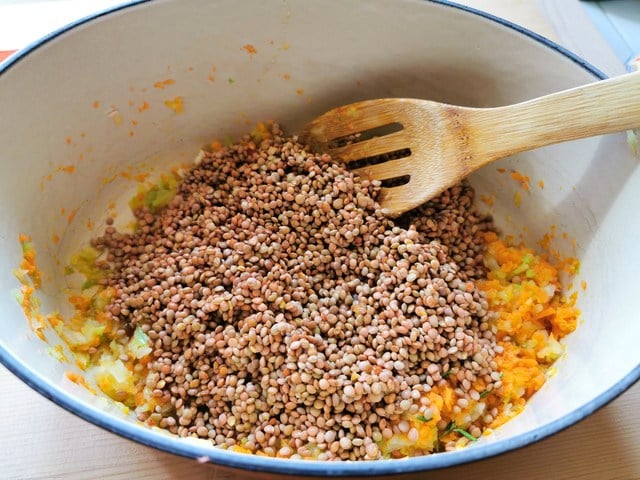 dried lentils added to the cooked vegetables in Dutch oven