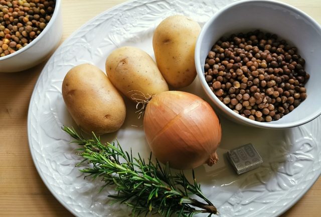 ingredients for umbrian wild pea soup on white plate