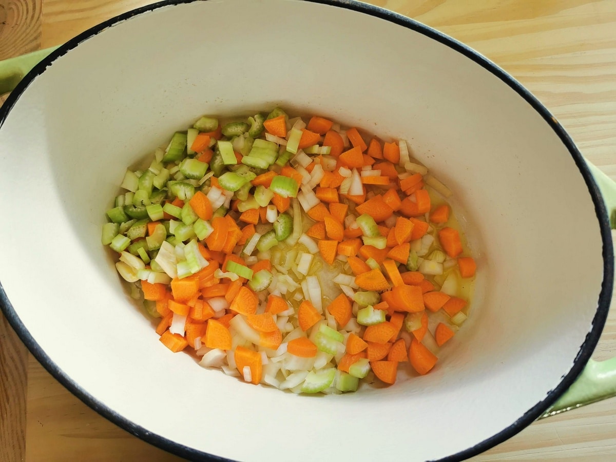 Diced onion, carrots and celery cooking in olive oil.