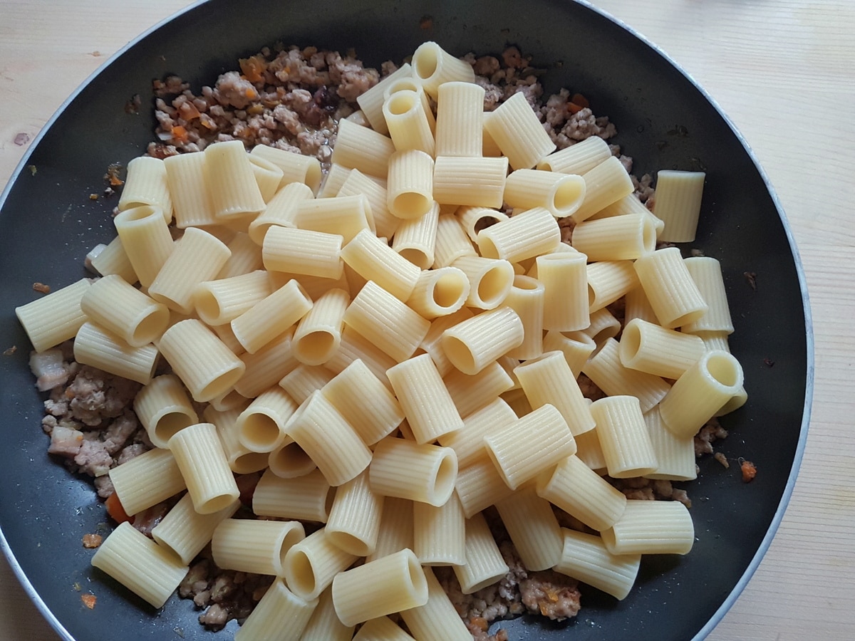 Pasta added to the white ragu sauce.