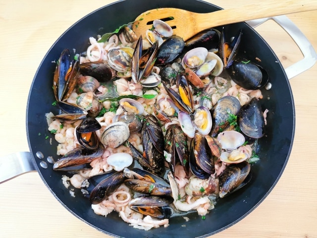 ready seafood sauce in skillet