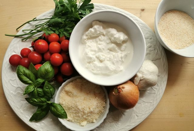 ingredients for pasta alla Tranese on white plate