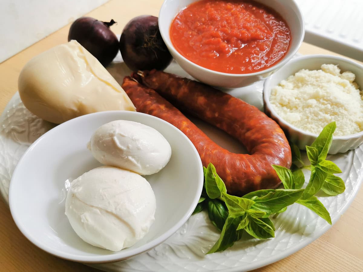 Ingredients for baked ziti pasta with sausage.