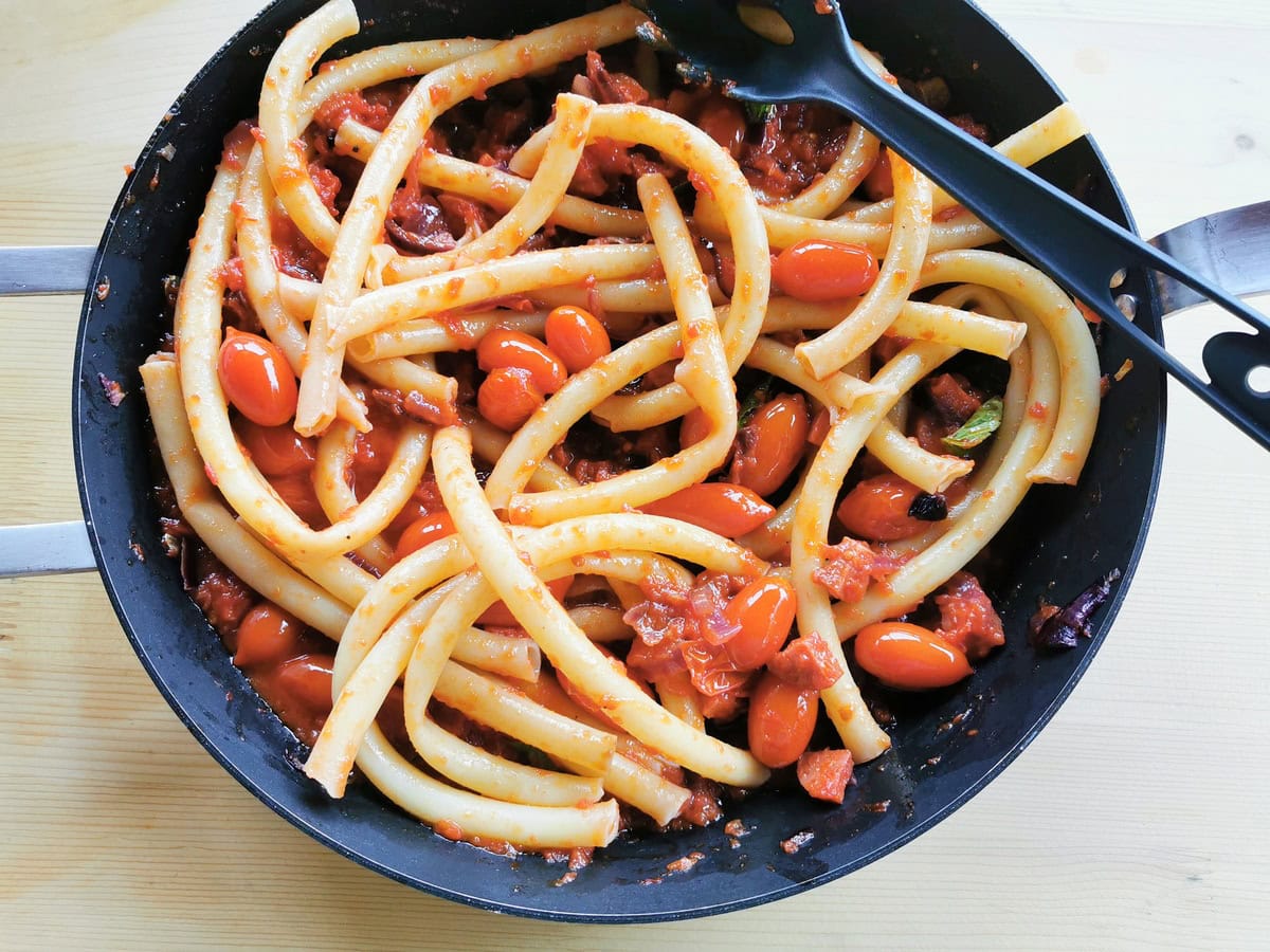 Cooked ziti pasta mixed with the sausage sauce.