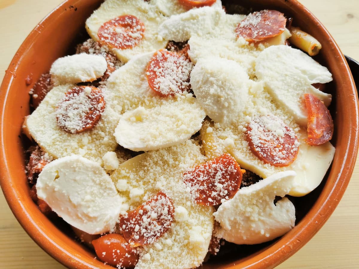 Layered pasta and sausage with cheese.
