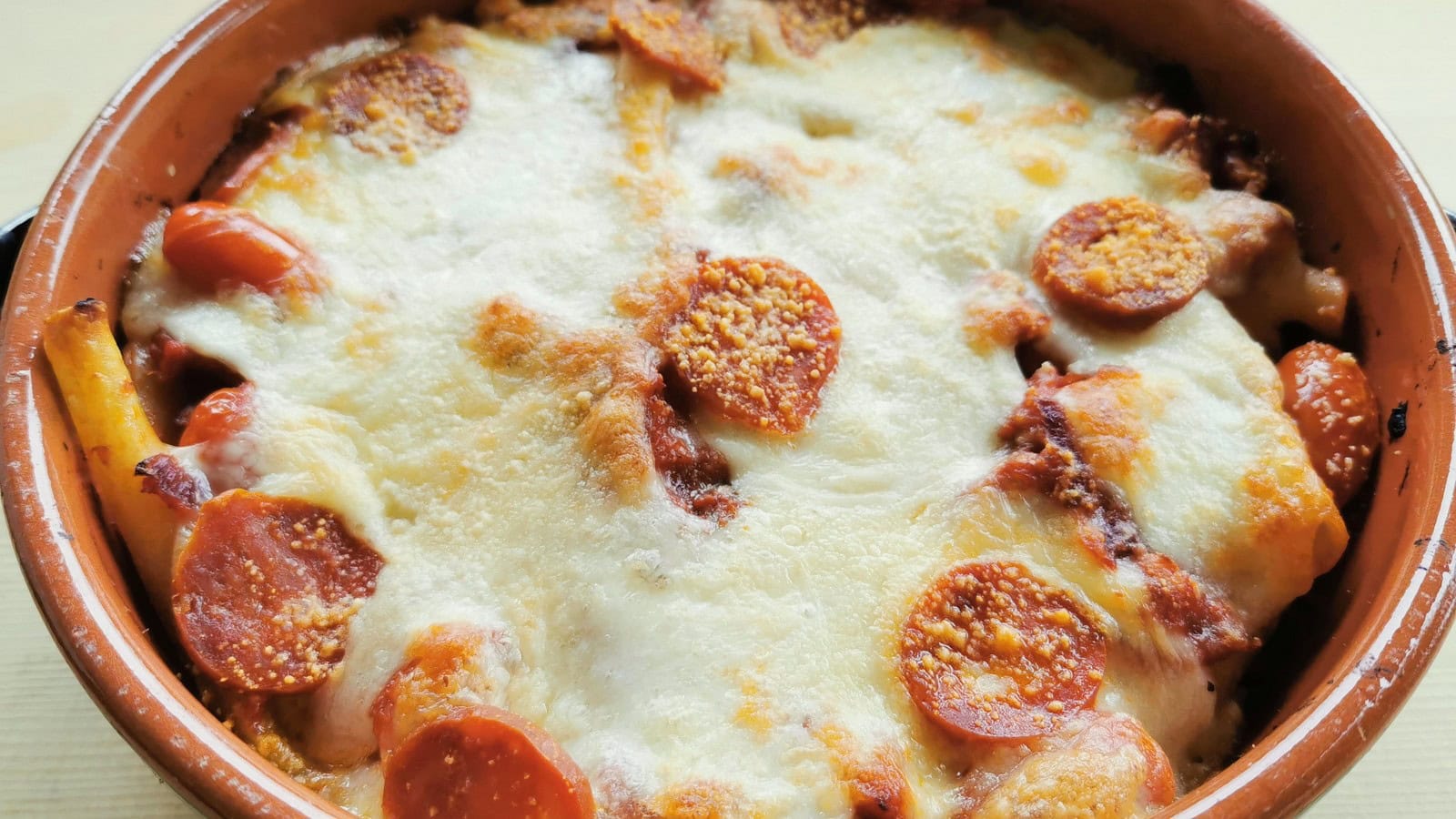 Easy baked ziti with spicy Italian sausage recipe.